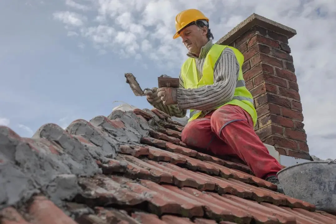 Roofer - a construction worker who works on the roof of a building