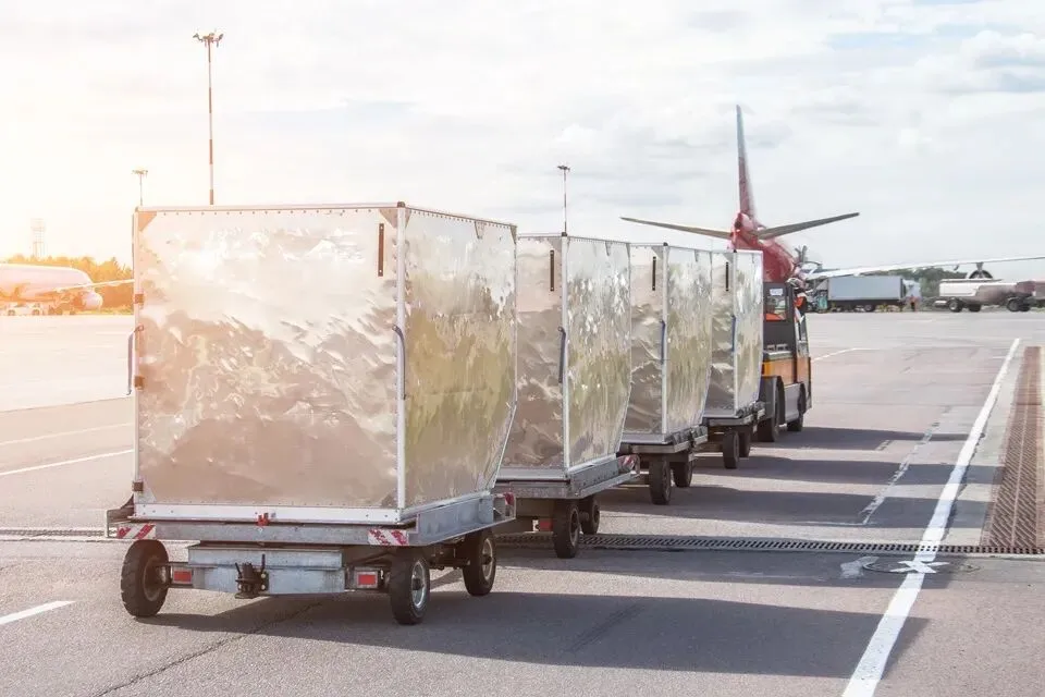 ULDs being transported on airport runway
