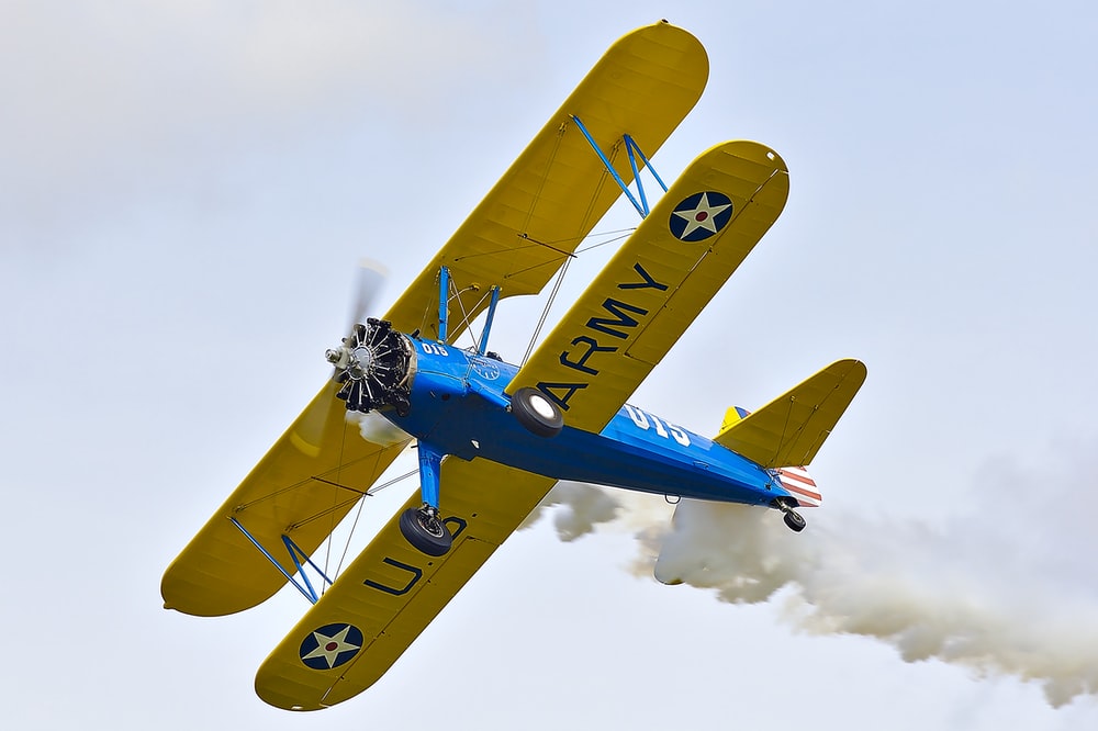 blue and yellow plane